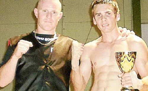 Gympie kickboxer Tyrone Spencer, pictured with trainer Billy Degoumois, put his controversial debut in the ring behind him to notch up an impressive victory in Hervey Bay a fortnight ago. Gympie kickboxer Tyrone Spencer, pictured with trainer Billy Degoumois, put his controversial debut in the ring behind him to notch up an impressive victory in Hervey Bay a fortnight ago.